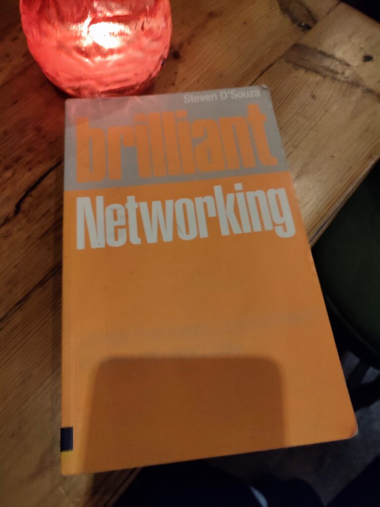 Brilliant Networking book by Steve D'Souza which has a very bright orange and silver cover