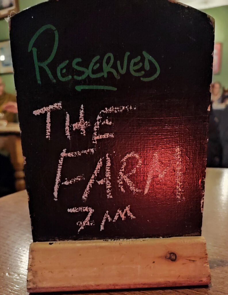 A small chalk sign reads Reserved The Farm 7pm